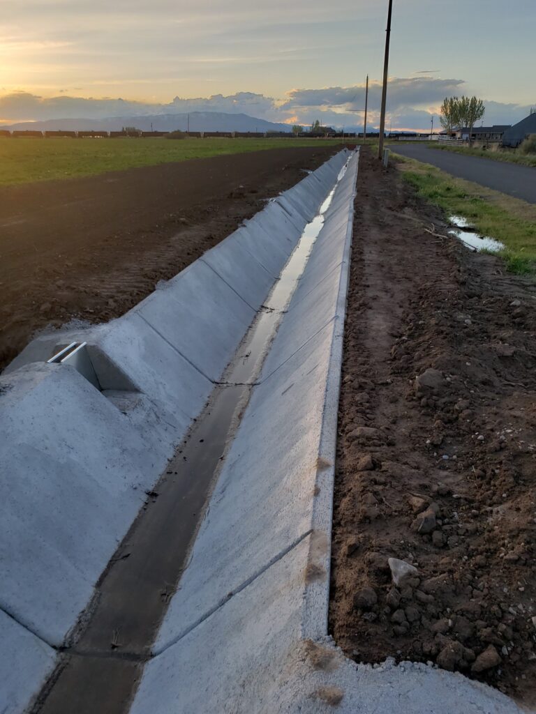 Dual Tin Outlets for a tighter seal on ditches that irrigate and convey flow to others downstream